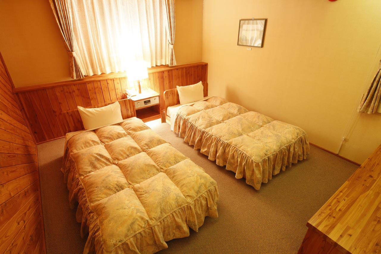 Log Hotel Larch Lake Kanayama Minamifurano Rom bilde