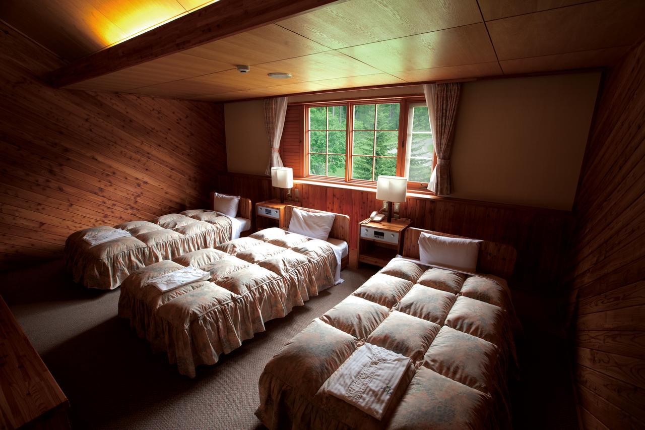 Log Hotel Larch Lake Kanayama Minamifurano Rom bilde