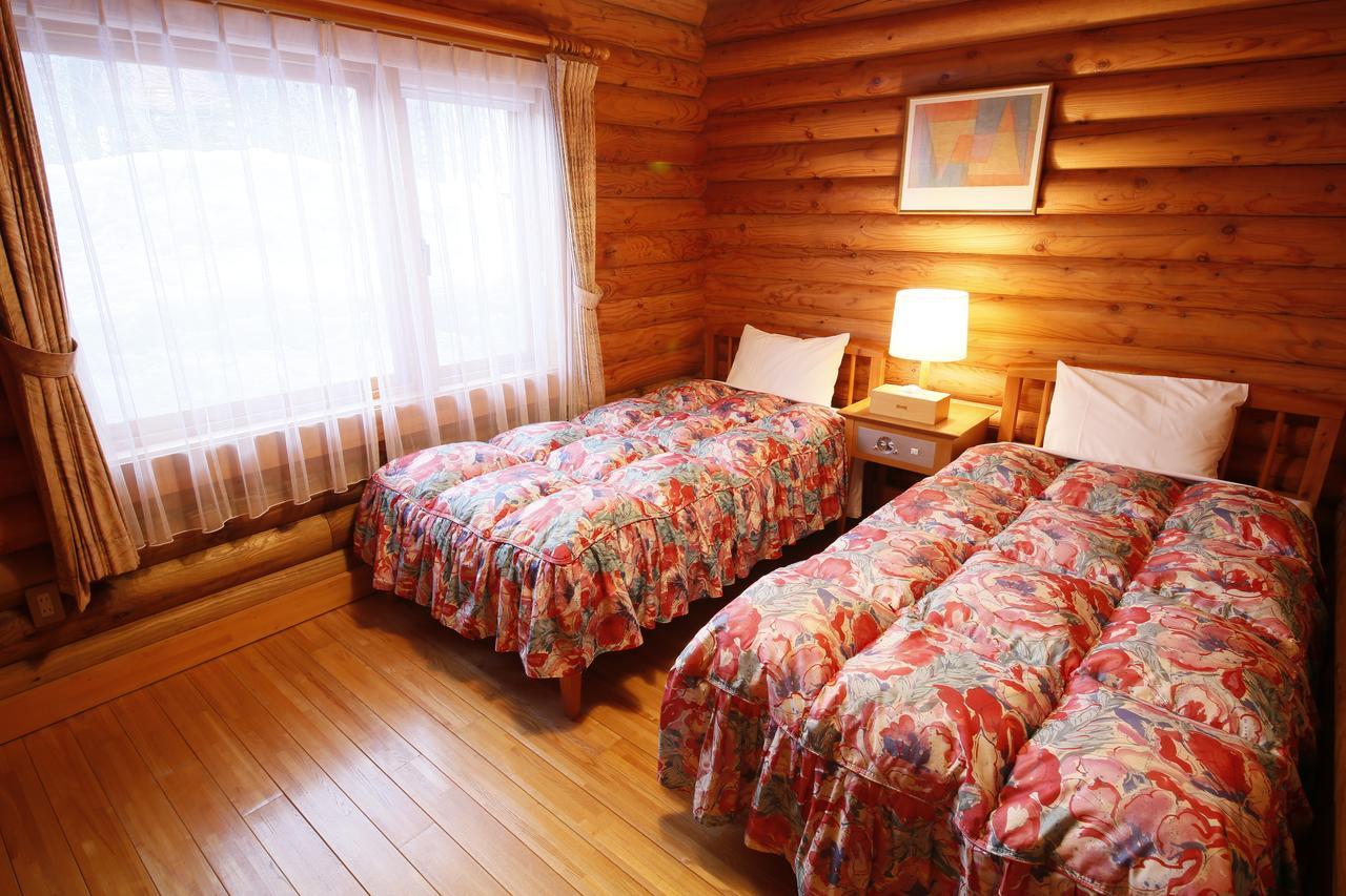 Log Hotel Larch Lake Kanayama Minamifurano Rom bilde